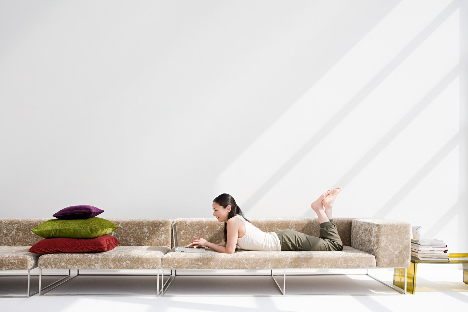 Japanese woman relaxing on sofa