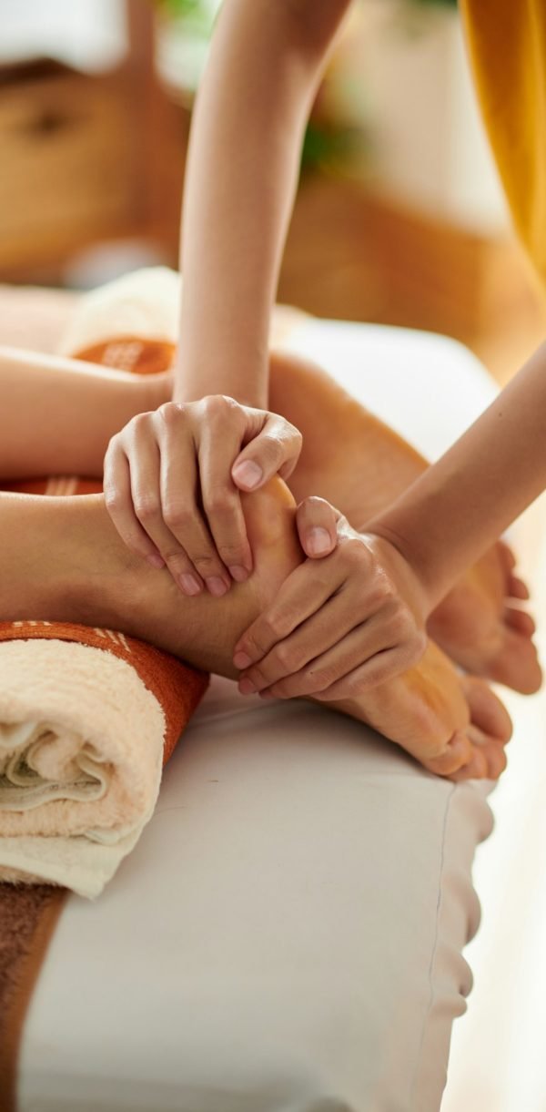 Massaging Feet of Female Client